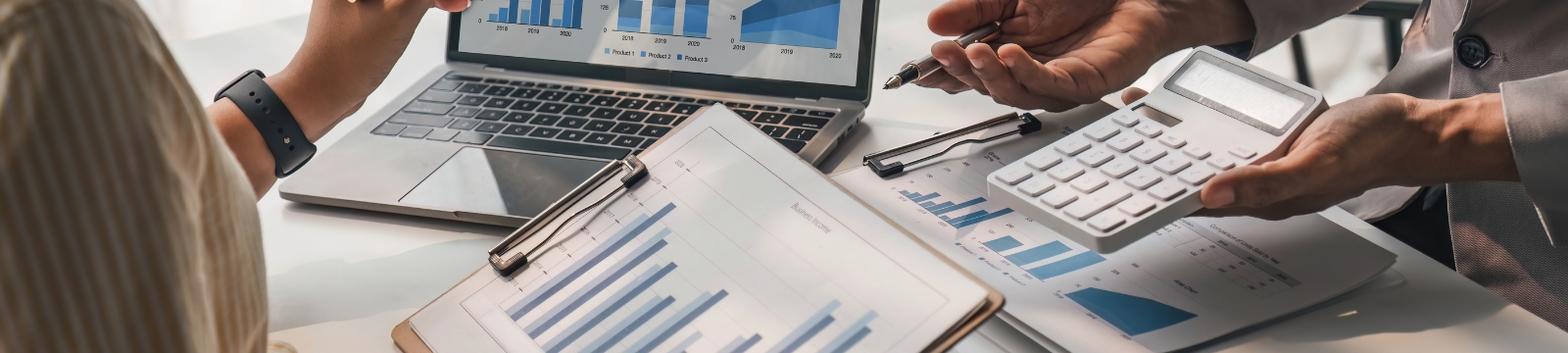 Man Jumping Outside Holding a Tablet